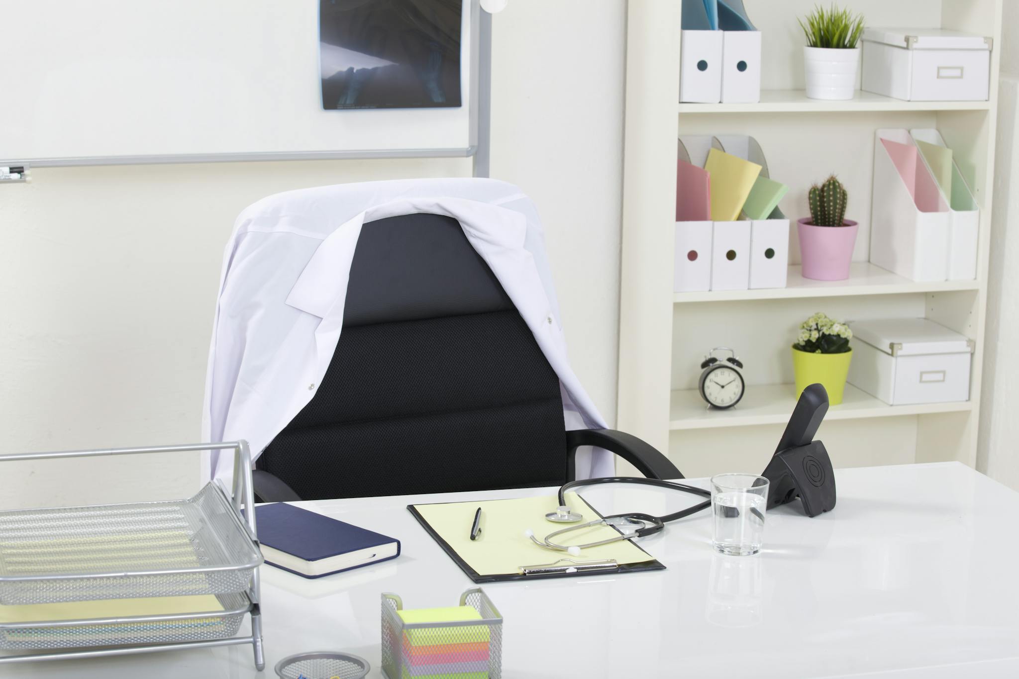 A clean and organized medical office featuring a stethoscope on a desk, symbolizing healthcare professionalism.