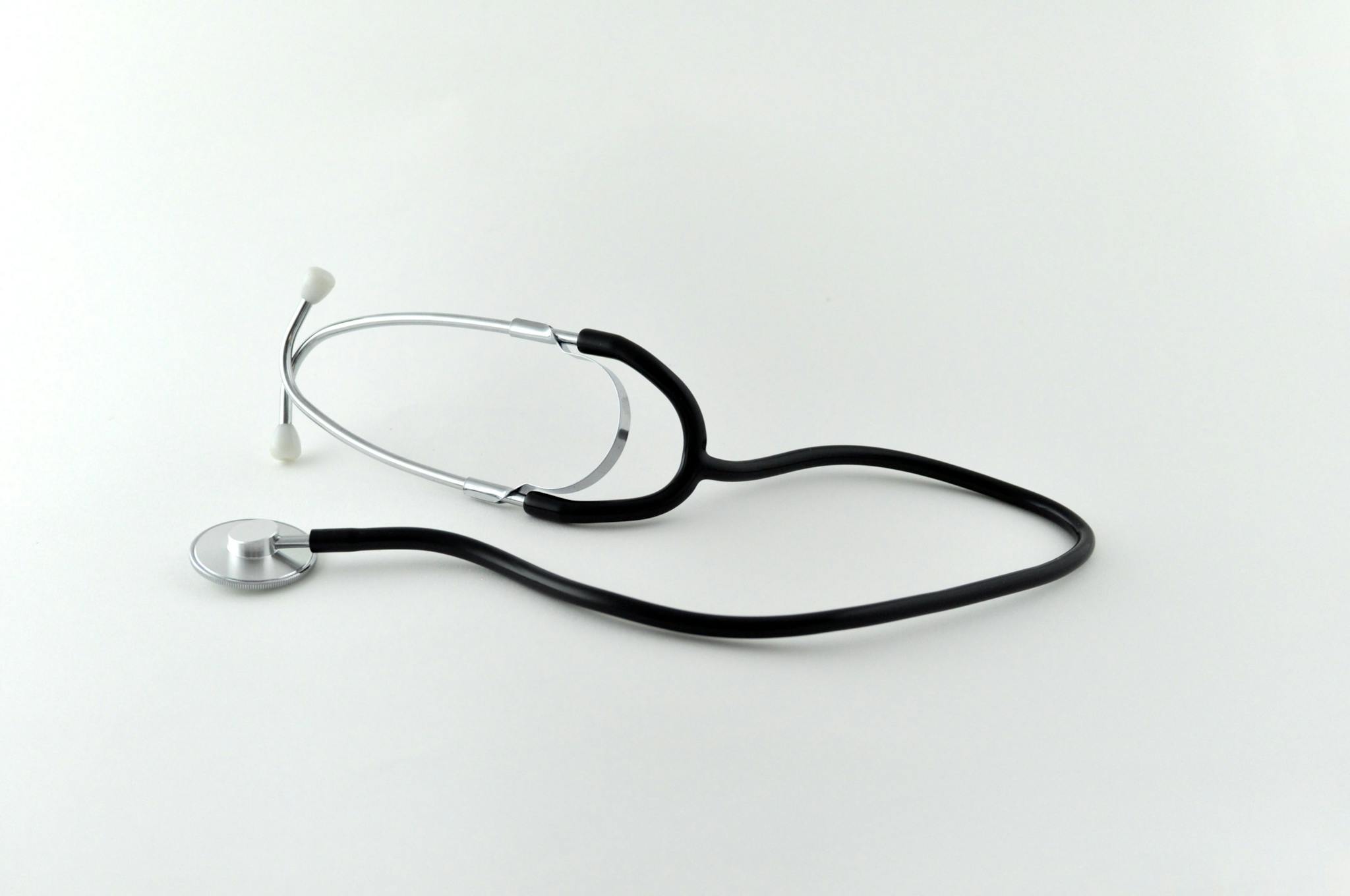 A simple and elegant image of a stethoscope on a white background, highlighting medical essentials.